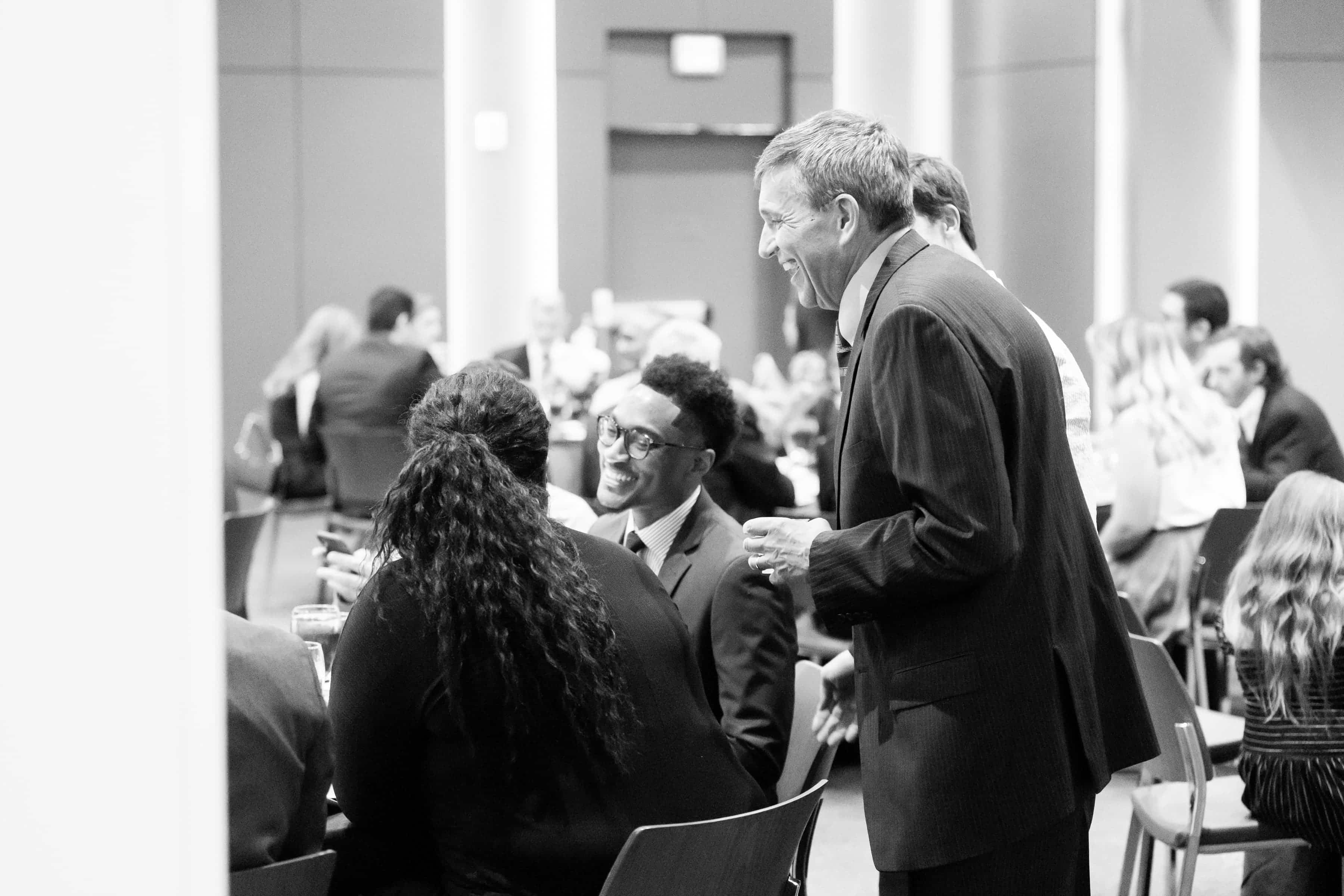 Dr. Doug Bacon conversing with Dr. Tyler Shack